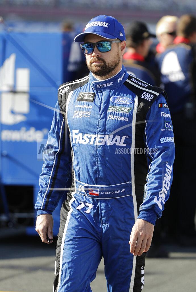 Chuck Burton Ricky Stenhouse Jr. walks down pit road before qualifying for Saturday's NASCAR All-Star Cup series auto race at Charlotte Motor Speedway in Concord, N.C., Friday, May 17, 2019. (AP Photo/Chuck Burton)