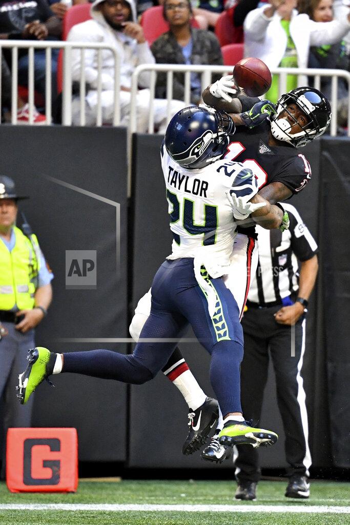 Danny Karnik Atlanta Falcons wide receiver Calvin Ridley (18) misses the catch against Seattle Seahawks cornerback Jamar Taylor (24) during the second half of an NFL football game, Sunday, Oct. 27, 2019, in Atlanta. The Seattle Seahawks won 27-20. (AP Photo/Danny Karnik)