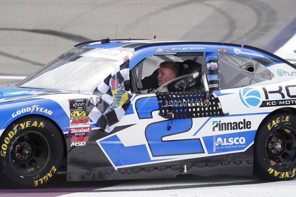 Carlos Osorio Tyler Reddick drives to victory lane after winning the NASCAR Xfinity Series auto race at Michigan International Speedway, Saturday, June 8, 2019, in Brooklyn, Mich. (AP Photo/Carlos Osorio)