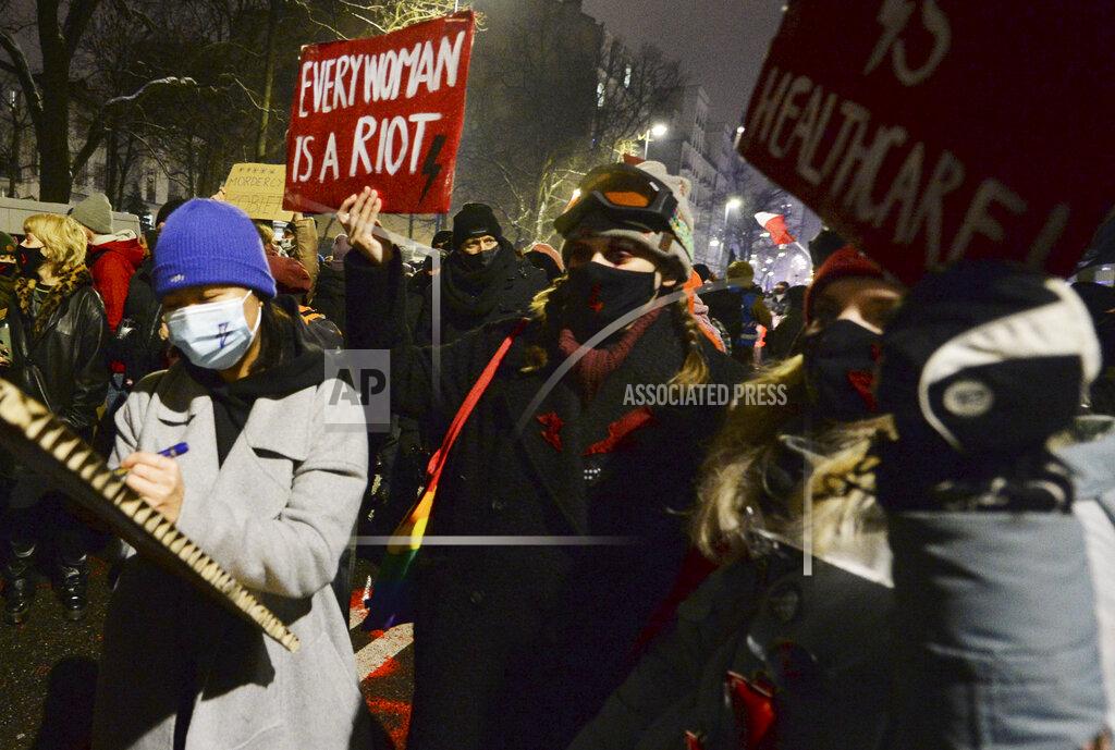 Czarek Sokolowski People march during a protest against a new anti-abortion law in Warsaw, Poland, Thursday, Jan. 28, 2021. A near-total ban on abortion has taken effect in Poland three months after a top court ruled that the abortion of congenitally damaged fetuses is unconstitutional. Led by a women’s rights group, people poured onto the streets of Warsaw and other cities for the second evening in a row on Thursday to protest the move. (AP Photo/Czarek Sokolowski)