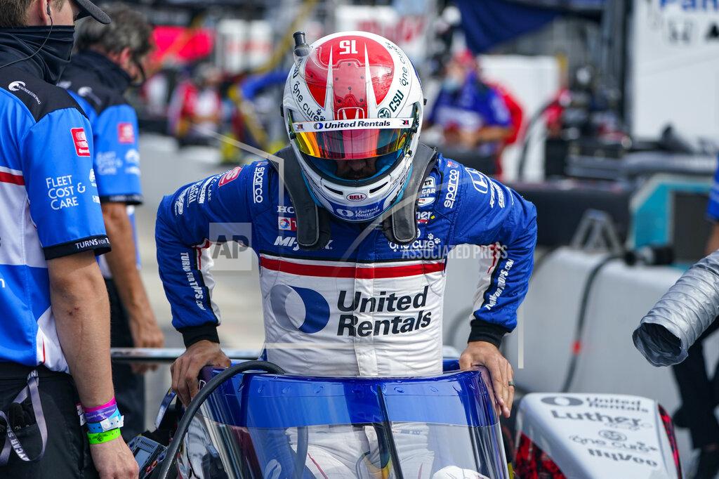 Michael Conroy Graham Rahal climbs into his car during practice for the Indianapolis 500 auto race at Indianapolis Motor Speedway in Indianapolis, Friday, Aug. 14, 2020. (AP Photo/Michael Conroy)
