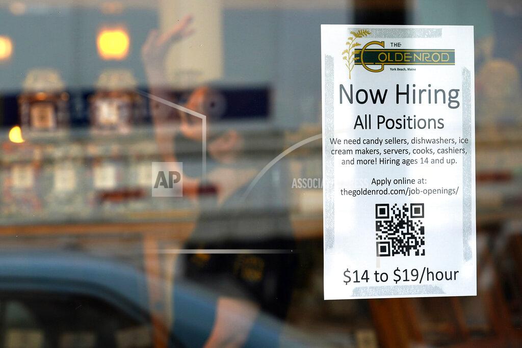 Robert F. Bukaty FILE - A sign advertises for help The Goldenrod, a popular restaurant and candy shop, Wednesday, June 1, 2022, in York Beach, Maine. America’s hiring boom continued in July as employers added a surprising 528,000 jobs despite raging inflation and rising anxiety about a recession. (AP Photo/Robert F. Bukaty)