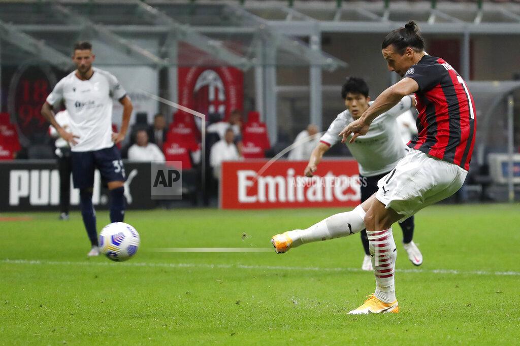 Antonio Calanni AC Milan's Zlatan Ibrahimovic scores with penalty against Bologna during the Serie A soccer match between AC Milan and Bologna at the San Siro stadium, in Milan, Italy, Monday, Sept. 21, 2020. (AP Photo/Antonio Calanni)