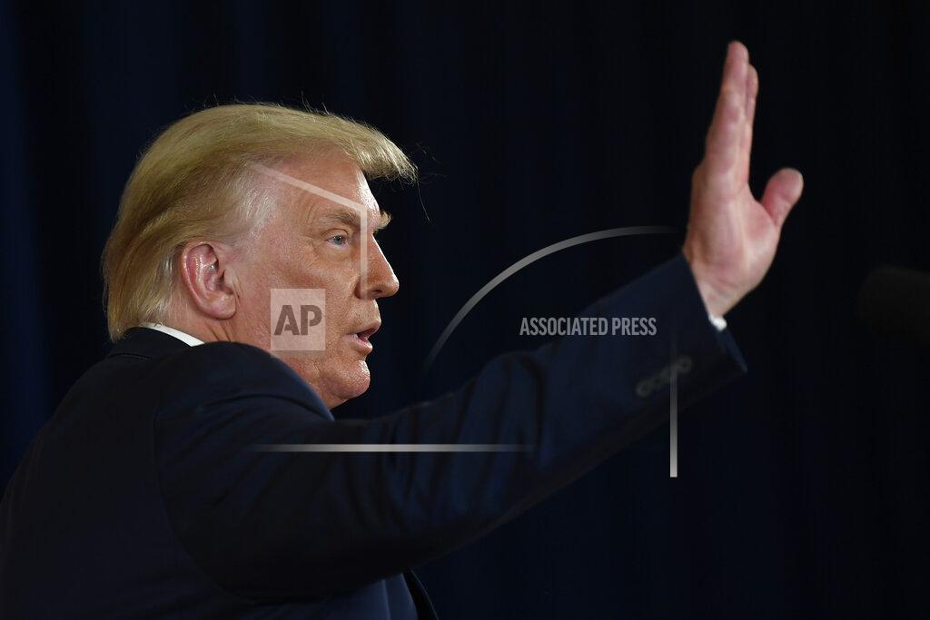 President Donald Trump waves goodbye after signing four executive orders during a news conference at the Trump National Golf Club in Bedminster, N.J., Saturday, Aug. 8, 2020. (AP Photo/Susan Walsh)