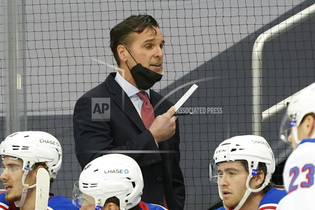 Keith Srakocic FILE - New York Rangers head coach David Quinn works from the bench as his team plays against the Pittsburgh Penguins during an NHL hockey game in Pittsburgh, in this Sunday, March 7, 2021, file photo. The New York Rangers fired coach David Quinn and three assistant coaches Wednesday, May 12, 2021, after missing the playoffs with one of the NHL's up-and-coming young teams. (AP Photo/Keith Srakocic), FIle