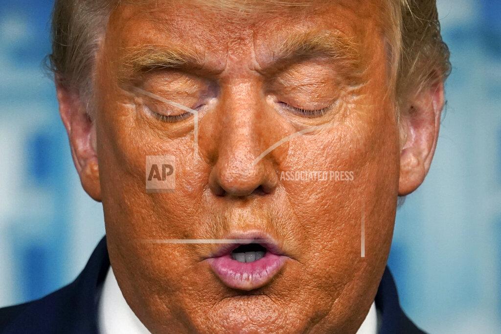 President Donald Trump looks down at his notes as he speaks at the White House, Thursday, Nov. 5, 2020, in Washington. (AP Photo/Evan Vucci)