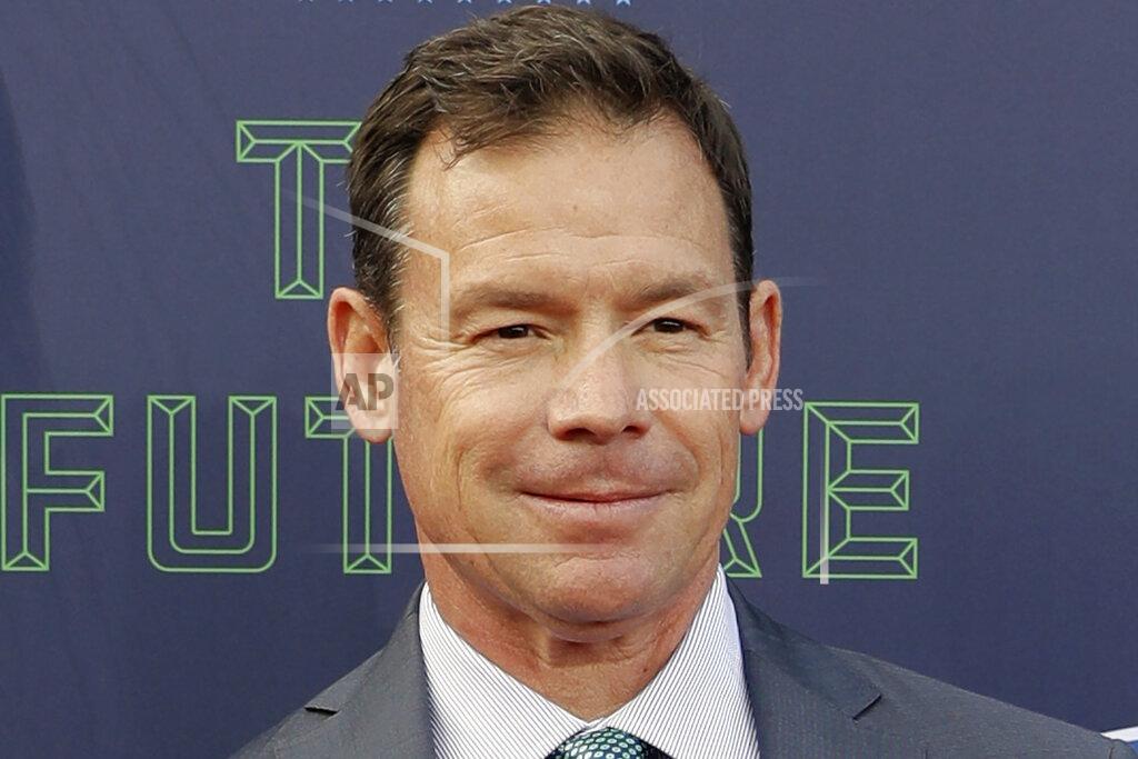 Eric Gay FILE - Jim Mora poses for photos on the red carpet before the first round of the 2018 NFL football draft in Arlington, Texas on April 26, 2018. On Thursday, Nov. 11, 2021, UConn hired former UCLA coach Jim Mora, who also coached two NFL teams, to lead the Huskies. Mora has been out of coaching and has been working as a television analyst after spending six seasons (2012-17) leading UCLA to a 46-30 record. (AP Photo/Eric Gay, File)