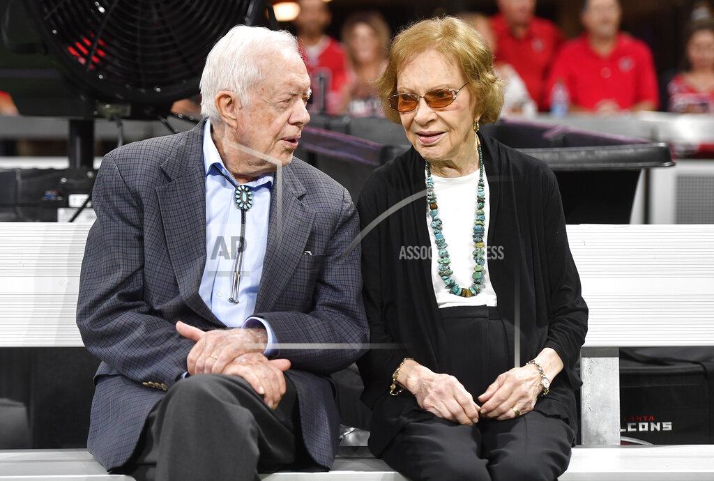 John Amis FILE - In this Sept. 30, 2018, file photo former President Jimmy Carter and Rosalynn Carter are seen ahead of an NFL football game between the Atlanta Falcons and the Cincinnati Bengals in Atlanta. Jimmy Carter and his wife Rosalynn celebrate their 75th anniversary this week on Thursday, July 7, 2021. (AP Photo/John Amis, File)