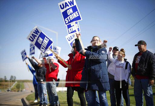 Members of the United Auto Workers strike outside of the John Deere Engine Works plant on Ridgeway Avenue in Waterloo, Iowa, on Friday, Oct. 15, 2021. About 10,000 UAW workers have gone on strike against John Deere since Thursday at plants in Iowa, Illinois and Kansas.(Bryon Houlgrave/The Des Moines Register via AP)