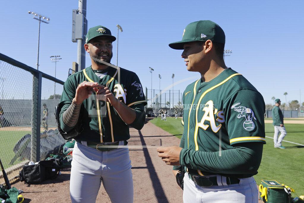 Darron Cummings Oakland Athletics' Sean Manaea, left, talks with Jesus Luzardo during spring training baseball practice, Thursday, Feb. 13, 2020, in Mesa, Ariz. (AP Photo/Darron Cummings)