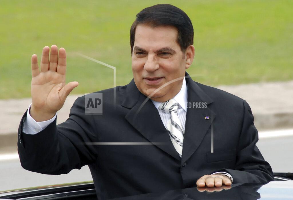 Hassene Dridi FILE - In this Oct.11, 2009 file photo, then Tunisian President Zine El Abidine Ben Ali waves from his car at a campaign rally in Rades, outside Tunis. On Thursday Jan. 14, 2021, Tunisia commemorates 10-years since the flight into exile of its iron-fisted leader, Zine El Abidine Ben Ali, pushed from power in a popular revolt that foreshadowed the so-called Arab Spring, but without festive celebrations because of the coronavirus lockdown. (AP Photo/Hassene Dridi, File)