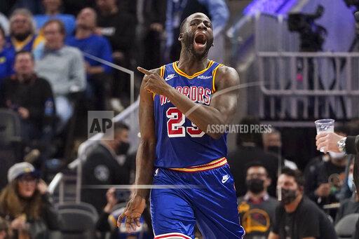 Golden State Warriors forward Draymond Green (23) reacts after being called for a foul during the second half of the team's NBA basketball game against the Phoenix Suns in San Francisco, Friday, Dec. 3, 2021. (AP Photo/Jeff Chiu)