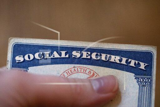 This Tuesday, Oct. 12, 2021, photo shows a Social Security card in Tigard, Ore. Millions of retirees on Social Security will get a 5.9% boost in benefits for 2022. The biggest cost-of-living adjustment in 39 years follows a burst in inflation as the economy struggles to shake off the drag of the coronavirus pandemic. (AP Photo/Jenny Kane)