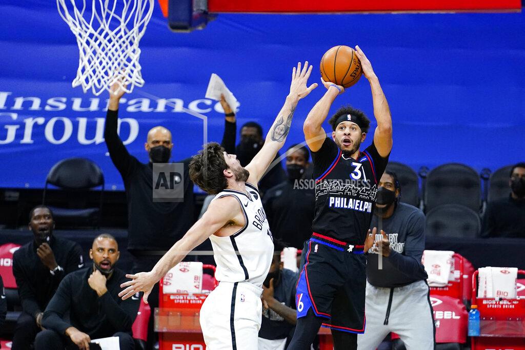 Matt Slocum Philadelphia 76ers' Seth Curry (31) goes up for a shot against Brooklyn Nets' Joe Harris (12) during the second half of an NBA basketball game, Saturday, Feb. 6, 2021, in Philadelphia. (AP Photo/Matt Slocum)