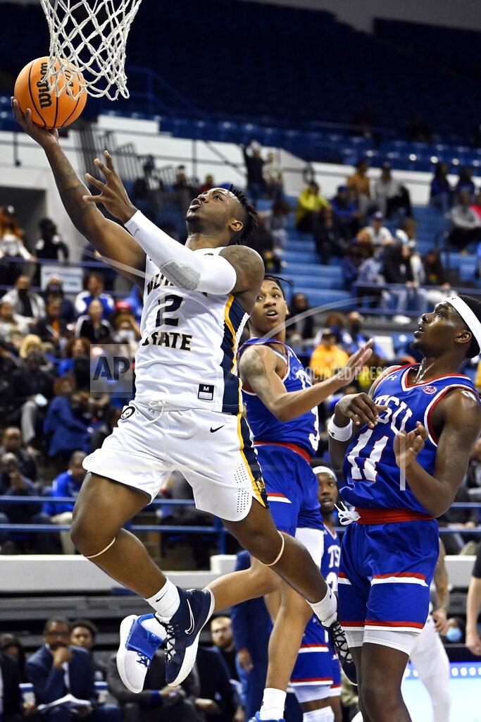 Mark Zaleski Murray State guard Trae Hannibal (2) drives past Tennessee State forward Kassim Nicholson (11) during the first half of an NCAA college basketball game Thursday, Feb. 10, 2022, in Nashville, Tenn. (AP Photo/Mark Zaleski)