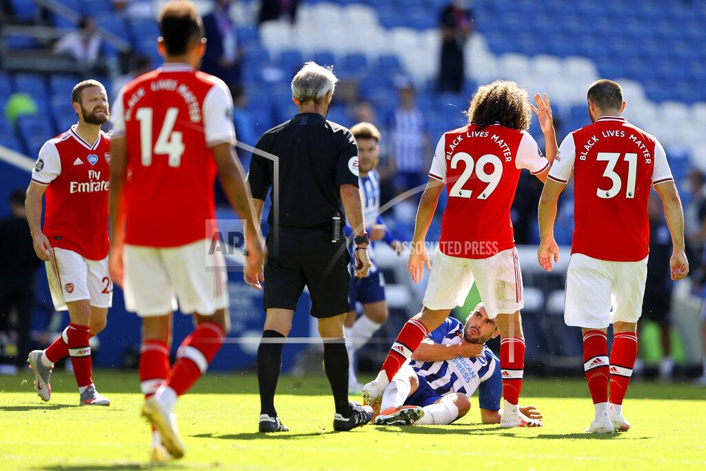 Richard Heathcote Arsenal's Matteo Guendouzi, 2nd right, gestures at Brighton's Neal Maupay, on the ground, during an argument at the end of during the English Premier League soccer match between Brighton & Hove Albion and Arsenal at the AMEX Stadium in Brighton, England, Saturday, June 20, 2020. (Richard Heathcote/Pool via AP)
