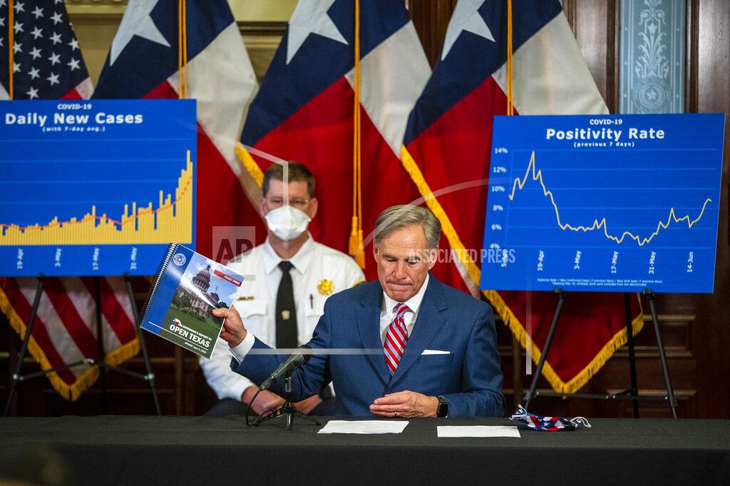 Ricardo B. Brazziell Gov. Greg Abbott addresses a news conference at the State Capitol in Austin, Texas, about the coronavirus pandemic Monday, June 22, 2020. Abbott said he has no plans to shut down the state again. "We must find ways to return to our daily routines as well as finding ways to coexist with COVID-19," Abbott said. (Ricardo B. Brazziell/Austin American-Statesman via AP)