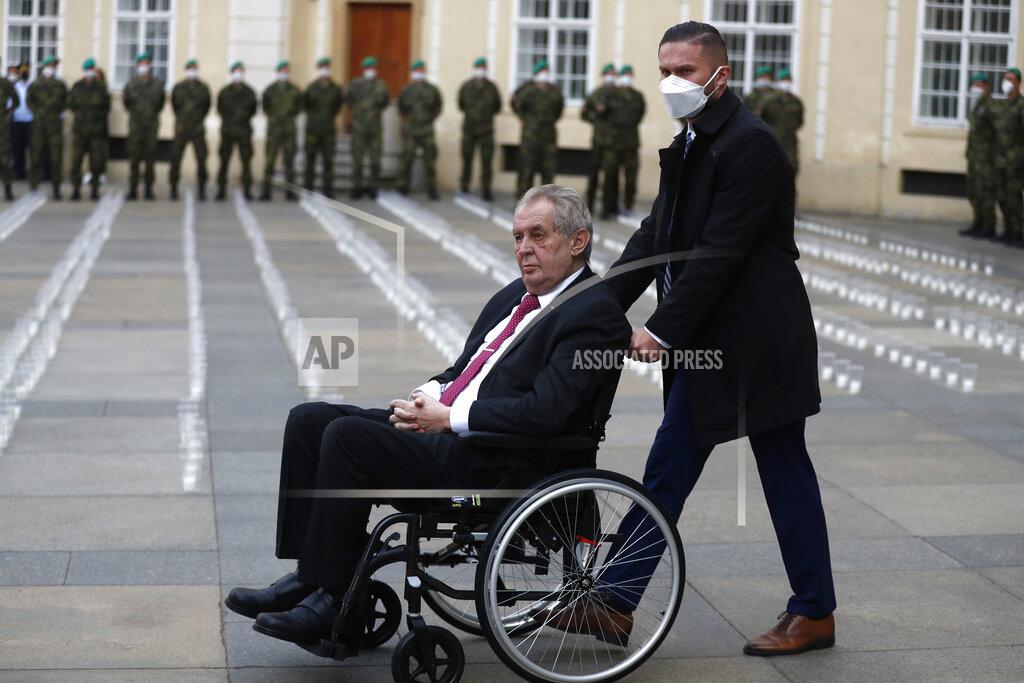 Petr David Josek Czech Republic's President Milos Zeman is escorted by a helper, as he arrives to light a candle to commemorate victims of the COVD-19 pandemic at the Prague Castle in Prague, Czech Republic, Monday, May 10, 2021. The Czech Republic is massively relaxing its coronavirus restrictions as the hard-hit nation pays respect to nearly 30,000 dead. (AP Photo/Petr David Josek)