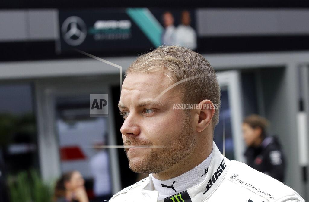 Luca Bruno Mercedes driver Valtteri Bottas of Finland walks through the paddock prior to the start of the first free practice at the 'Sochi Autodrom' Formula One circuit, in Sochi, Russia, Friday, Sept. 27, 2019. The Formula one race will be held on Sunday. (AP Photo/Luca Bruno)