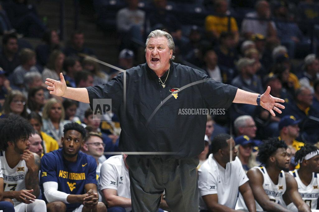 Kathleen Batten West Virginia coach Bob Huggins reacts during the second half of an NCAA college basketball game against Oakland in Morgantown, W.Va., Tuesday, Nov. 9, 2021. (AP Photo/Kathleen Batten)