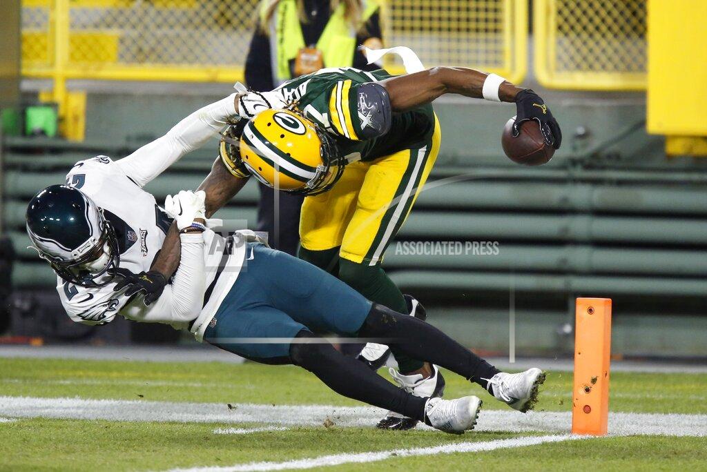Matt Ludtke Green Bay Packers' Davante Adams catches a touchdown pass with Philadelphia Eagles' Darius Slay defending during the second half of an NFL football game Sunday, Dec. 6, 2020, in Green Bay, Wis. The pass was Aaron Rodgers' 400th career touchdown pass.(AP Photo/Matt Ludtke)