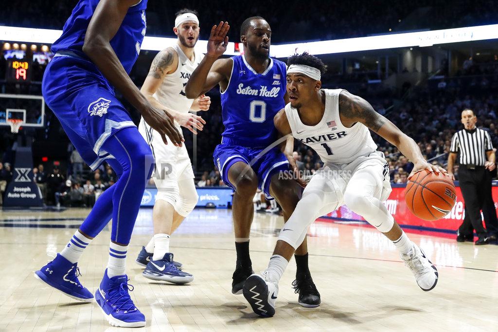 John Minchillo Xavier's Paul Scruggs (1) drives against Seton Hall's Quincy McKnight (0) during the first half of an NCAA college basketball game Wednesday, Jan. 2, 2019, in Cincinnati. (AP Photo/John Minchillo)