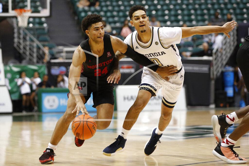 Marco Garcia Houston guard Quentin Grimes (24) slips past Georgia Tech guard Michael Devoe (0) during the second half of an NCAA college basketball game Monday, Dec. 23, 2019, in Honolulu. (AP Photo/Marco Garcia)