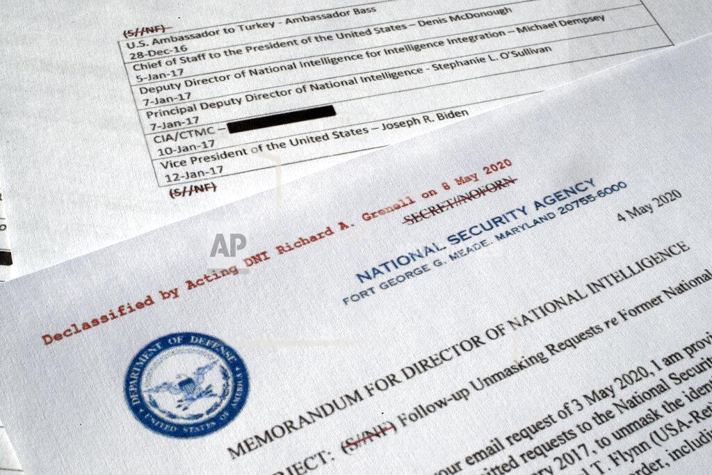 A declassified document with names of President Barack Obama administration officials who made requests for unmasking of Michael Flynn's name is photographed Wednesday, May 13, 2020. In 2016, Obama administration officials received intelligence reports that were concerning, but incomplete. Surveillance of Russia’s ambassador to the U.S. revealed he had interacted with an unnamed American who may have been undercutting efforts to pressure Vladimir Putin’s government. Using a common process known as “unmasking,” they asked intelligence agencies to reveal the American’s name. It was Flynn, an adviser to President-elect Donald Trump. The document was declassified by acting Director of National Intelligence Richard Grenell. (AP Photo/Jon Elswick)