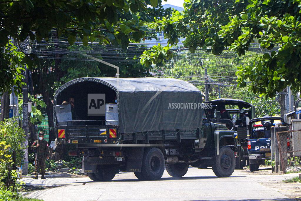 Uncredited A police vehicle is parked at a road in South Okkalapa township to block anti-coup protesters' gathering in Yangon, Myanmar, Friday, April 9, 2021. An information blackout under Myanmar's military junta worsened Thursday as fiber broadband service, the last legal way for ordinary people to access the internet, became intermittently inaccessible on several networks. (AP Photo)