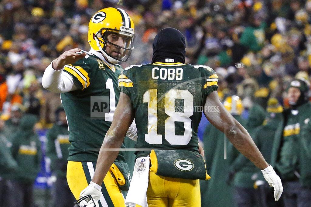 Mike Roemer FILE - In this Jan. 8, 2017, file photo, Green Bay Packers quarterback Aaron Rodgers (12) and wide receiver Randall Cobb (18) celebrate after a touchdown during the second half of an NFC wild-card NFL football game against the New York Giants, in Green Bay, Wis. Randall Cobb still talks to his old quarterback regularly despite the receiver’s move to the Dallas Cowboys after spending his first eight seasons with Aaron Rodgers and the Green Bay Packers. While Cobb hadn’t spoken to Rodgers as of the middle of the week leading to their first game against each other Sunday, the trusty slot man didn’t seem too hung up on avoiding contact. (AP Photo/Mike Roemer, File)