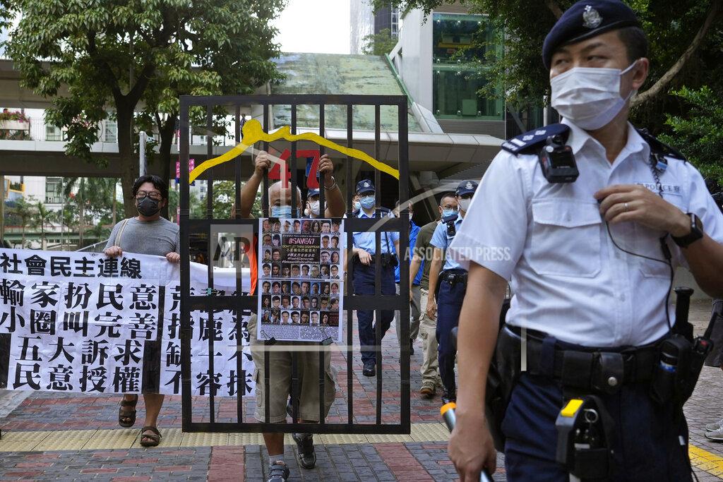 Vincent Yu A police officer guard at a street during a protest against an election committee that will vote for the city's leader in Hong Kong Sunday, Sept. 19, 2021. Hong Kong's polls for an election committee that will vote for the city's leader kicked off Sunday amid heavy police presence, with chief executive Carrie Lam saying that it is "very meaningful" as it is the first election to take place following electoral reforms. (AP Photo/Vincent Yu)