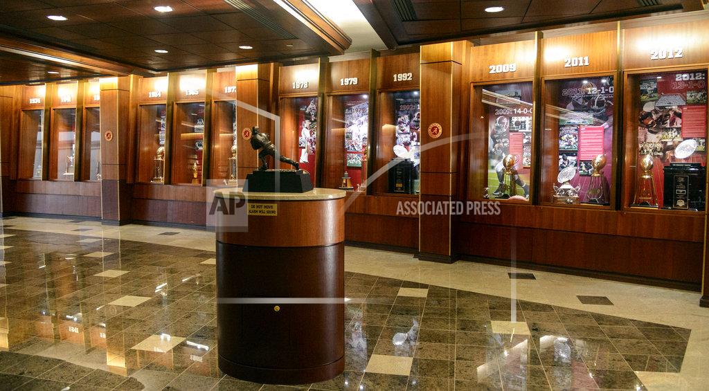 Vasha Hunt FILE - In this Aug. 28, 2013, file photo, Alabama trophies from numerous championship years are displayed in the Hall of Champions at the Mal M. Moore Athletic Facility in Tuscaloosa, Ala. Four Mississippi State University students are accused of breaking into the University of Alabama's athletic facility and stealing memorabilia. The break-in happened during the pre-dawn hours of April 4, 2018, six days before Alabama's national championship football team met with President Donald Trump at the White House, authorities said. The four managed to get inside the Mal M. Moore Athletic Facility and stole "various items of memorabilia," court records state. (Vasha Hunt/AL.com via AP)