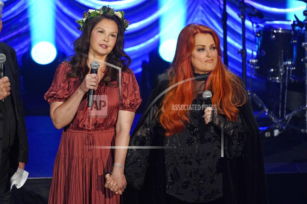 Mark Humphrey Ashley Judd, left, and Wynonna Judd speak during a tribute to their mother, country music star Naomi Judd, Sunday, May 15, 2022, in Nashville, Tenn. Naomi Judd died April 30. She was 76. (AP Photo/Mark Humphrey)