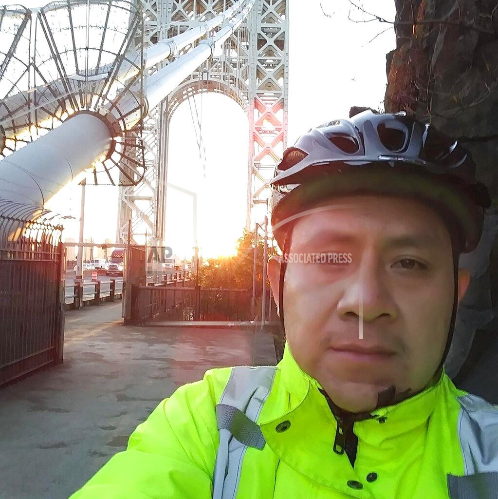 In this undated selfie, Martin Morales stands in front of the George Washington Bridge, which crosses the Hudson River between New Jersey and New York. Morales loved to ride his bike around northern New Jersey when he had some time to himself. To his family, this selfie is a reminder of just how far he had journeyed, from a remote village in southern Mexico to follow his older brother Javier to a new American life. Then, the new coronavirus extinguished both their lives, just a day apart. (Martin Morales/Courtesy of Sheila Cruz-Morales via AP)