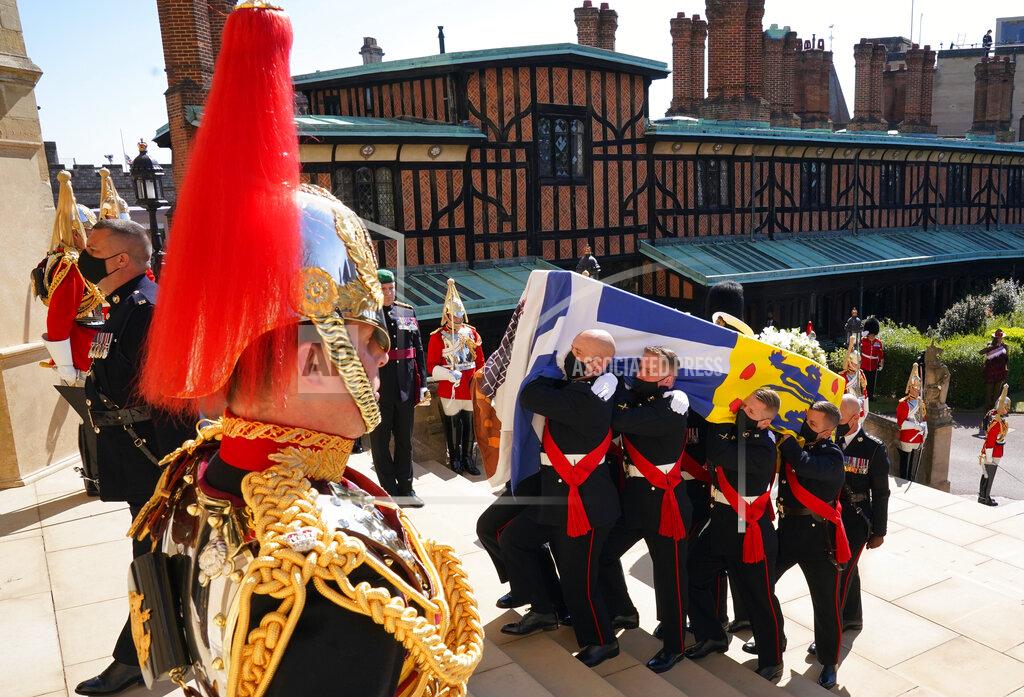 Arthur Edwards The coffin is carried up the steps of St George's Chapel during the procession of Britain Prince Philip's funeral at Windsor Castle, Windsor, England, Saturday April 17, 2021. Prince Philip died April 9 at the age of 99 after 73 years of marriage to Britain's Queen Elizabeth II. (Arthur Edwards/Pool via AP)