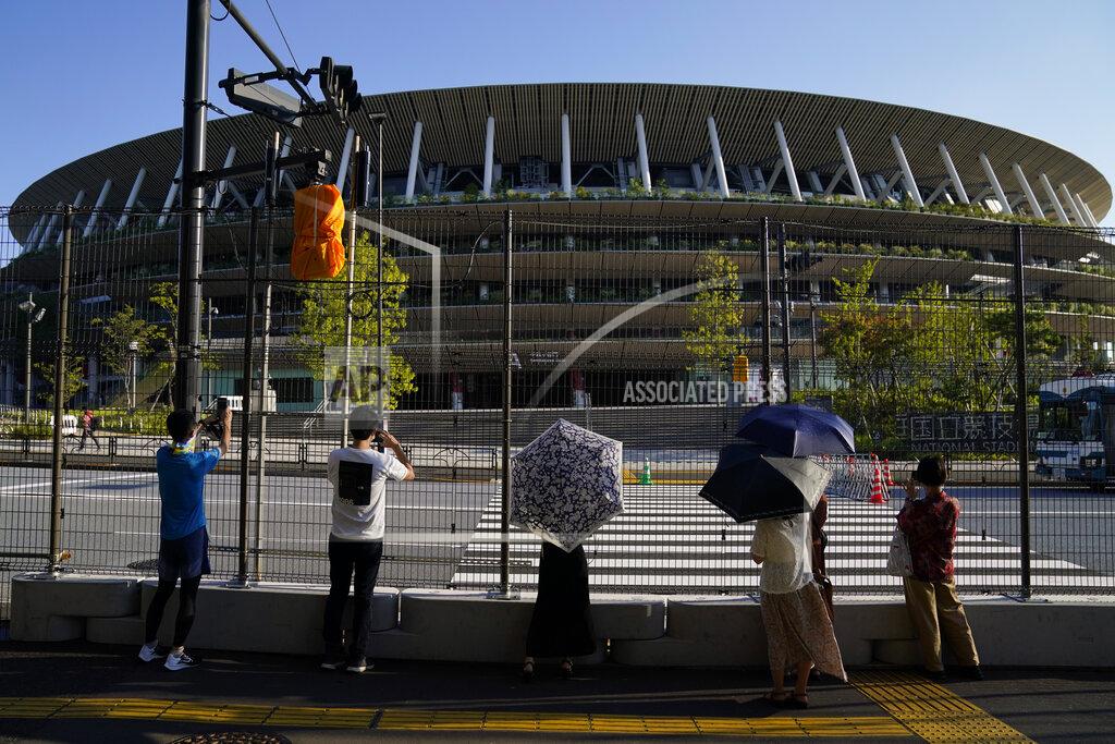 Jae C. Hong FILE. - In this Aug. 1, 2021, file photo, Spectators view the Olympic Stadium during the 2020 Summer Olympics in Tokyo, Japan. (AP Photo/Jae C. Hong, File)