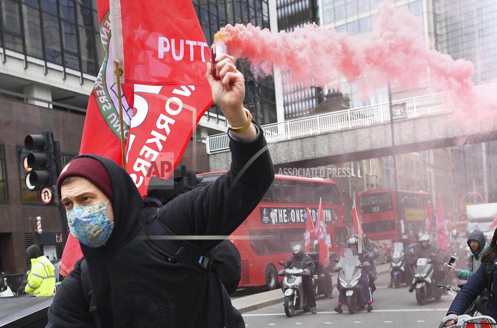 Stefan Rousseau A Deliveroo rider from the Independent Workers' Union of Great Britain (IWGB) as food delivery riders demonstrate in central London Wednesday April 7, 2021. Union organizers have said they expect hundreds of gig economy riders for app-based meal delivery platform Deliveroo to join strikes in 5 U.K. cities Wednesday, over pay and working conditions. (Stefan Rousseau/PA via AP)