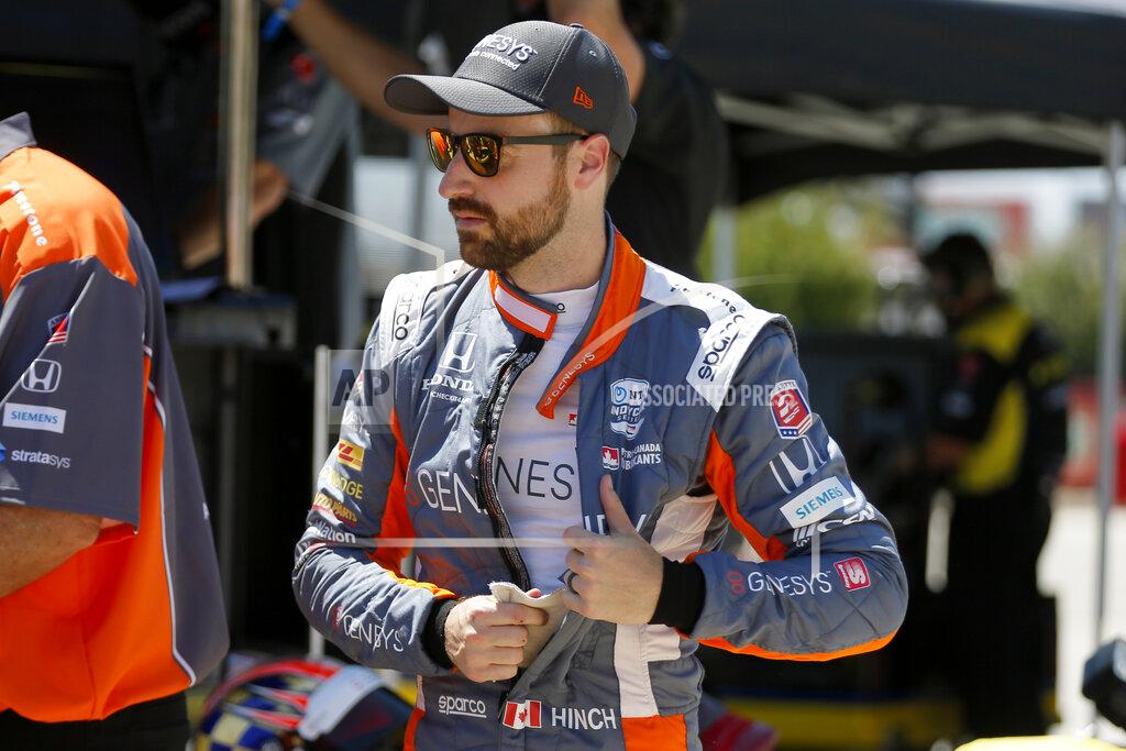 Tony Gutierrez FILE- In this June 6, 2020, file photo, James Hinchcliffe prepares for practice at the IndyCar auto race at Texas Motor Speedway in Fort Worth, Texas. Hinchcliffe will return to Andretti Autosport for the final three races of the season to fill the seat left vacant when Zach Veach stepped out of the car earlier this week, Andretti Autosport announced Friday, Sept. 25, 2020. (AP Photo/Tony Gutierrez, File)