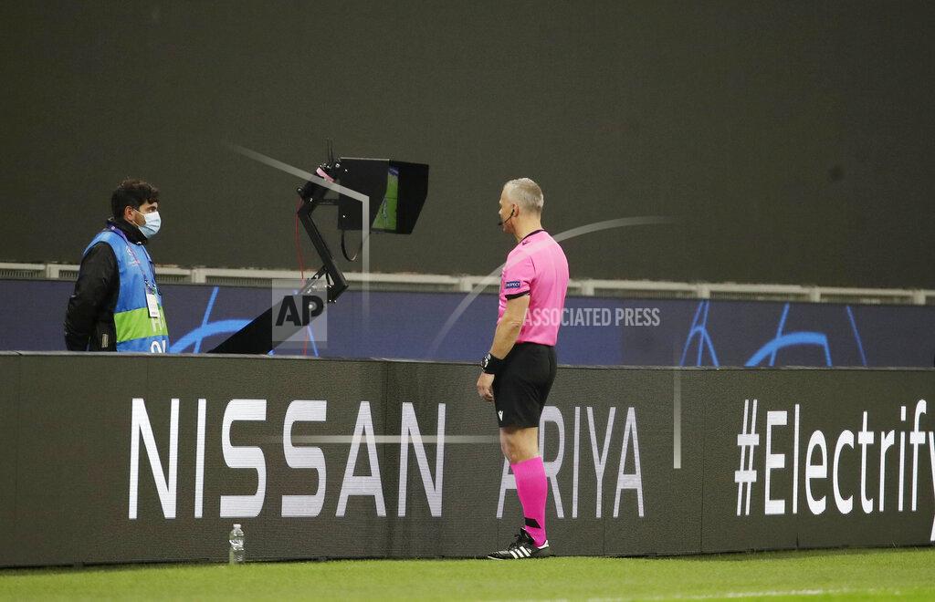 Luca Bruno Referee Bjorn Kuipers watches a VAR during the Champions League group B soccer match between Inter Milan and Borussia Moenchangladbach at the San Siro stadium in Milan, Italy, Wednesday, Oct. 21, 2020. (AP Photo/Luca Bruno)