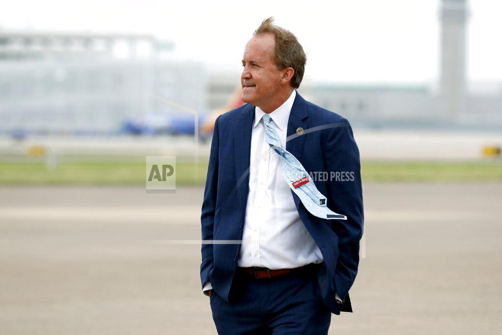 Tony Gutierrez FILE - In this June 28, 2020 file photo, Texas' Attorney General Ken Paxton waits on the flight line for the arrival of Vice President Mike Pence at Love Field in Dallas. (AP Photo/Tony Gutierrez, File)