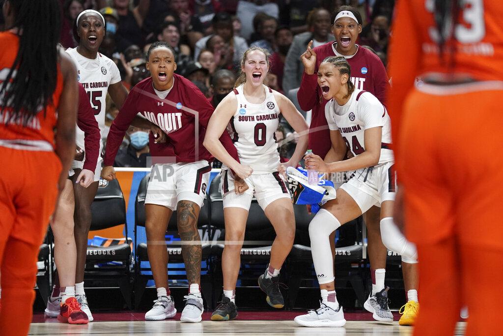 Sean Rayford South Carolina forward Laeticia Amihere (15), guard Eniya Russell, second from left, guard Olivia Thompson (0), guard LeLe Grissett (24), and forward Sania Feagin, right, celebrate a basket during the second half a second-round game against Miami in the NCAA college basketball tournament Sunday, March 20, 2022 in Columbia, S.C. South Carolina won 49-33. (AP Photo/Sean Rayford)
