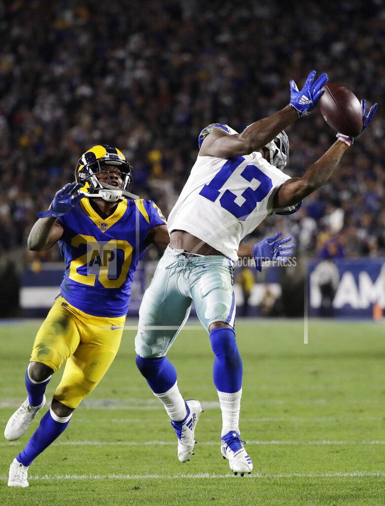 Marcio Jose Sanchez Dallas Cowboys wide receiver Michael Gallup catches a pass over Los Angeles Rams free safety Lamarcus Joyner during the second half in an NFL divisional football playoff game Saturday, Jan. 12, 2019, in Los Angeles. (AP Photo/Marcio Jose Sanchez)