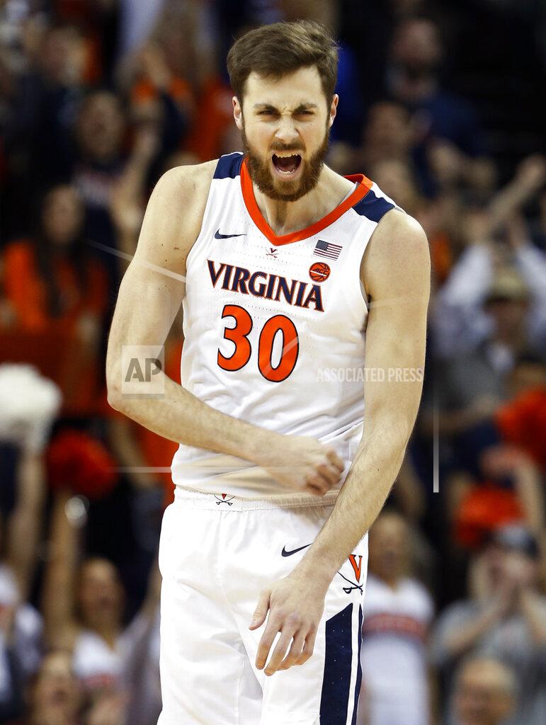 Steve Helber Virginia forward Jay Huff (30) reacts to a basket and a foul during the first half of an NCAA college basketball game in Charlottesville, Va., Saturday, March 9, 2019. (AP Photo/Steve Helber)