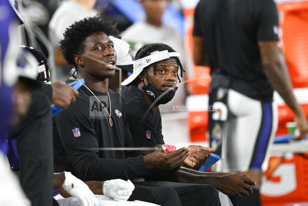 Nick Wass Baltimore Ravens wide receiver Sammy Watkins, left, and quarterback Lamar Jackson look on from the bench during the first half of an NFL preseason football game against the New Orleans Saints, Saturday, Aug. 14, 2021, in Baltimore. (AP Photo/Nick Wass)