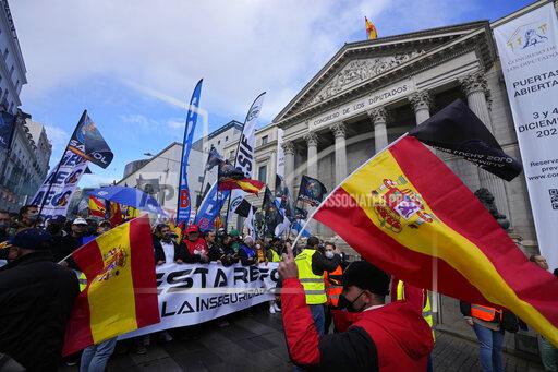 Police march past the Spanish parliament during a protest march in Madrid, Spain, Saturday, Nov. 27, 2021. Tens of thousands of Spanish police officers and their supporters rallied in Madrid on Saturday to protest against government plans to reform a controversial security law known by critics as the “gag law.” (AP Photo/Paul White)