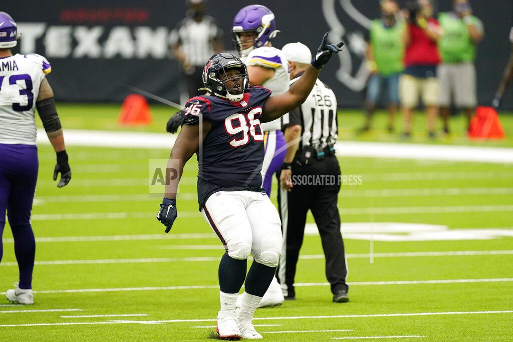 David J. Phillip Houston Texans defensive end P.J. Hall (96) celebrates after makes a play against the Minnesota Vikings during the second half of an NFL football game Sunday, Oct. 4, 2020, in Houston. (AP Photo/David J. Phillip)