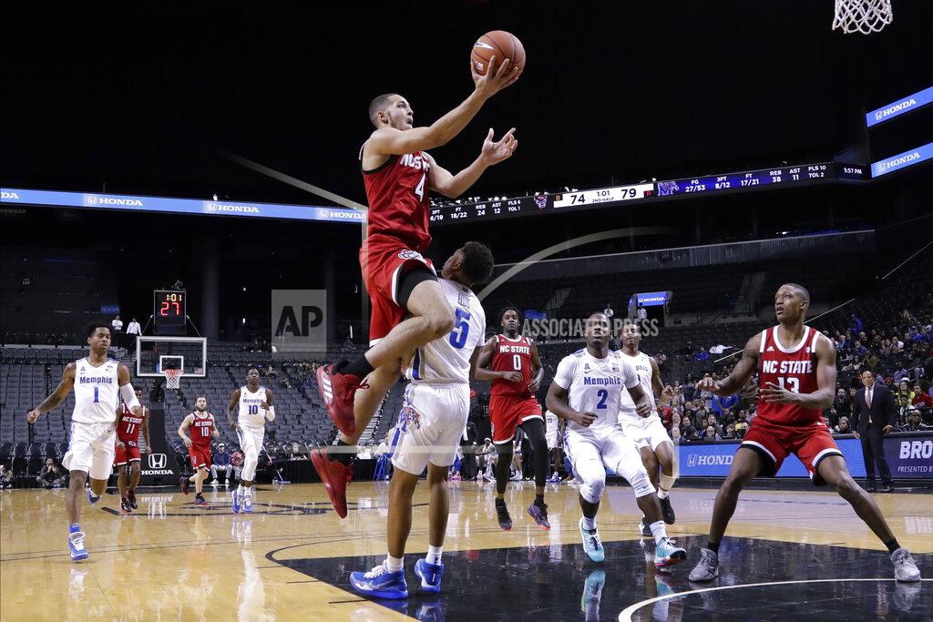 Frank Franklin Ii North Carolina State's Jericole Hellems (4) drives past Memphis' Boogie Ellis (5) during the second half of an NCAA college basketball game in the Barclays Classic, Thursday, Nov. 28, 2019, in New York. (AP Photo/Frank Franklin II)