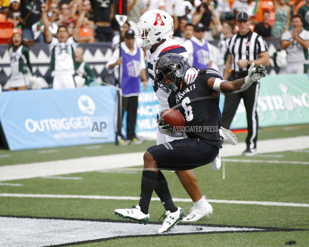 Marco Garcia Arizona safety Scottie Young Jr. (6) can't stop Hawaii wide receiver Cedric Byrd II (6) from making a first-quarter touchdown during an NCAA college football game Saturday, Aug. 24, 2019, in Honolulu. (AP Photo/Marco Garcia)