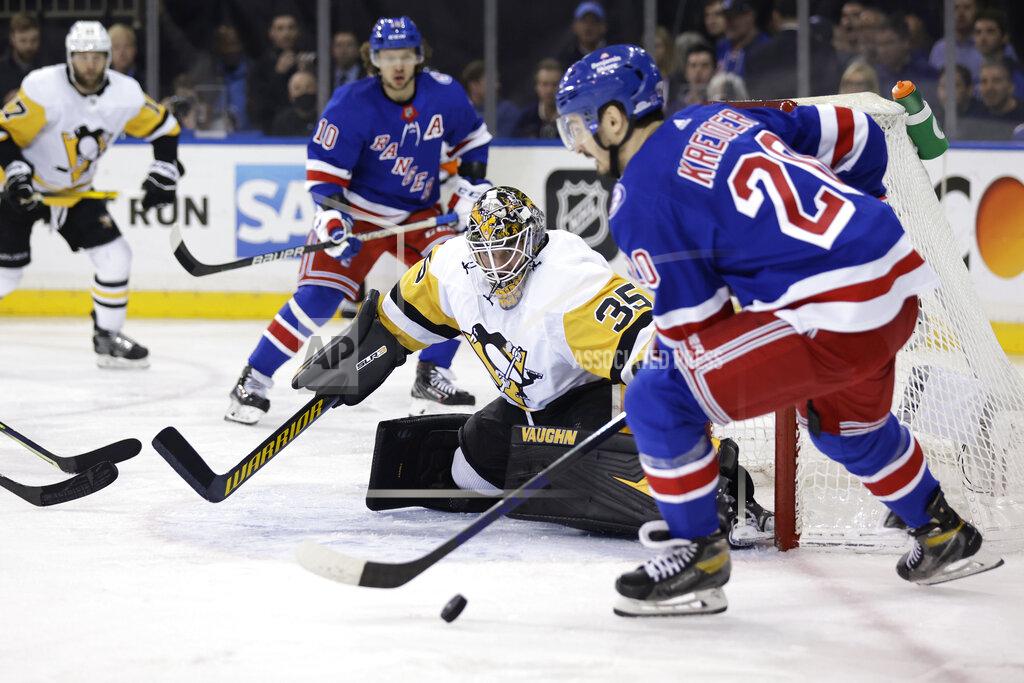 Adam Hunger Pittsburgh Penguins goaltender Tristan Jarry defends against New York Rangers left wing Chris Kreider during the second period in Game 7 of an NHL hockey Stanley Cup first-round playoff series Sunday, May 15, 2022, in New York. (AP Photo/Adam Hunger)