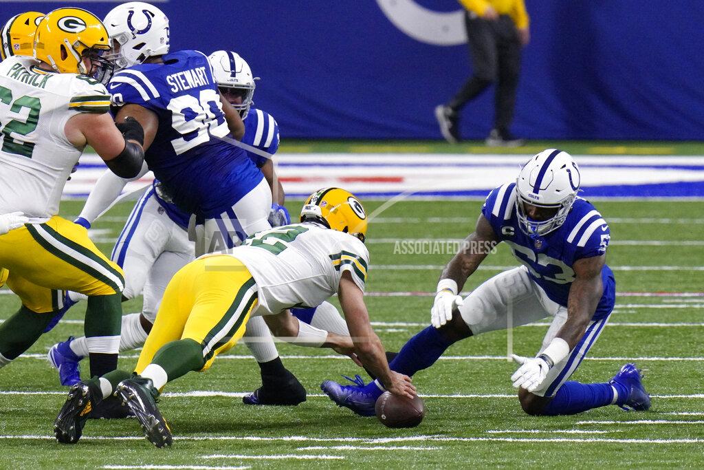 Aj Mast Green Bay Packers quarterback Aaron Rodgers (12) dives for a fumble against Indianapolis Colts' Darius Leonard (53) during the first half of an NFL football game, Sunday, Nov. 22, 2020, in Indianapolis. Leonard recovered the fumble. (AP Photo/AJ Mast)